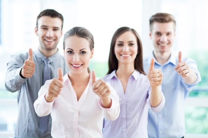 Business team with thumbs up